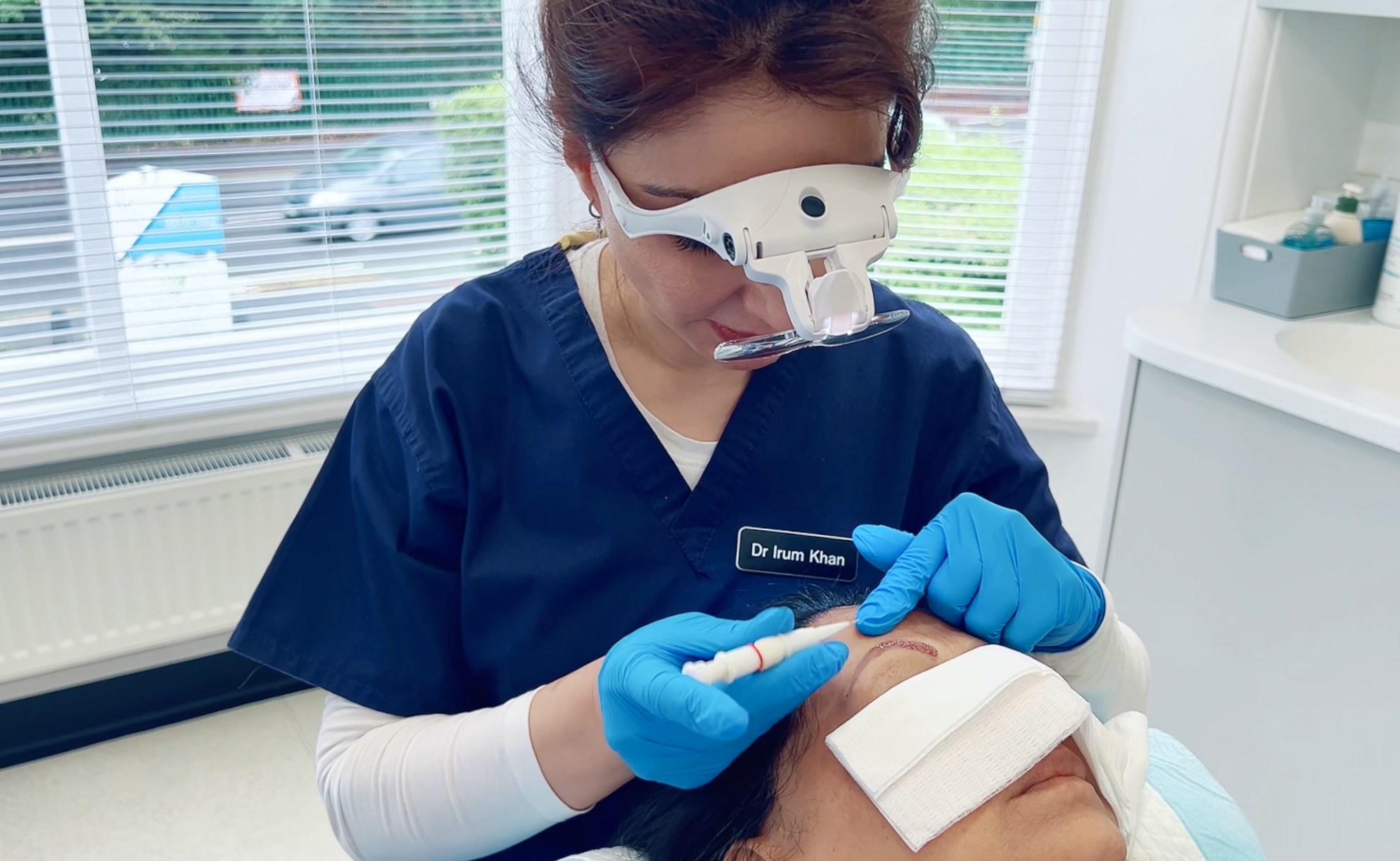 IK Clinics team performing eyebrow transplant with FUE technique.