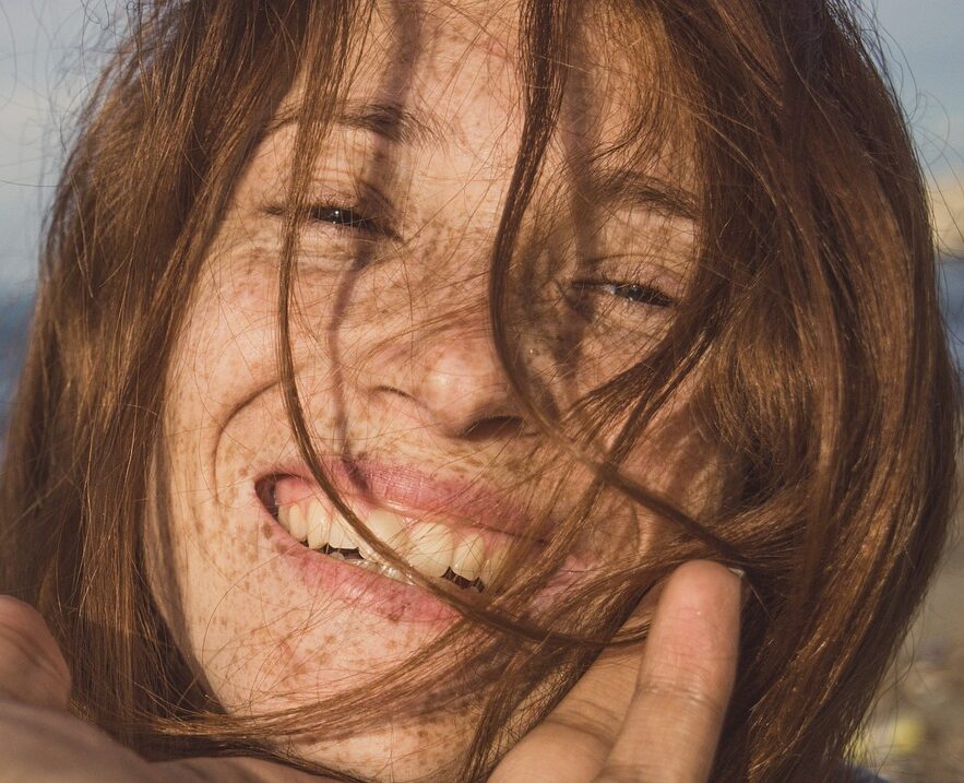 Woman Smiling showing smooth skin